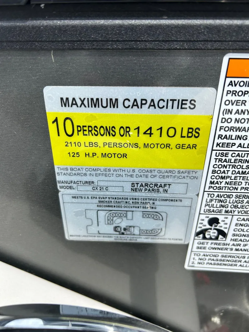 Slide: The Image of Starcraft CX21 boat capacity label, 10 persons or 1410 lbs, 125 HP motor, 2022 model. - 36