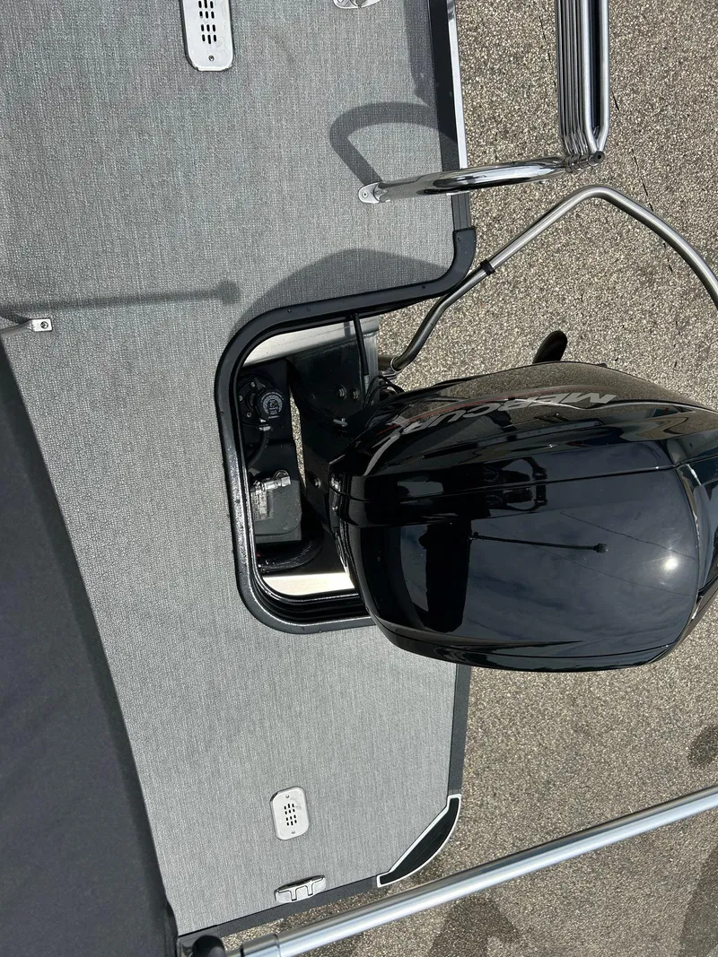 Slide: The Image of 2022 Starcraft CX21 boat with outboard motor and sleek deck design. - 40