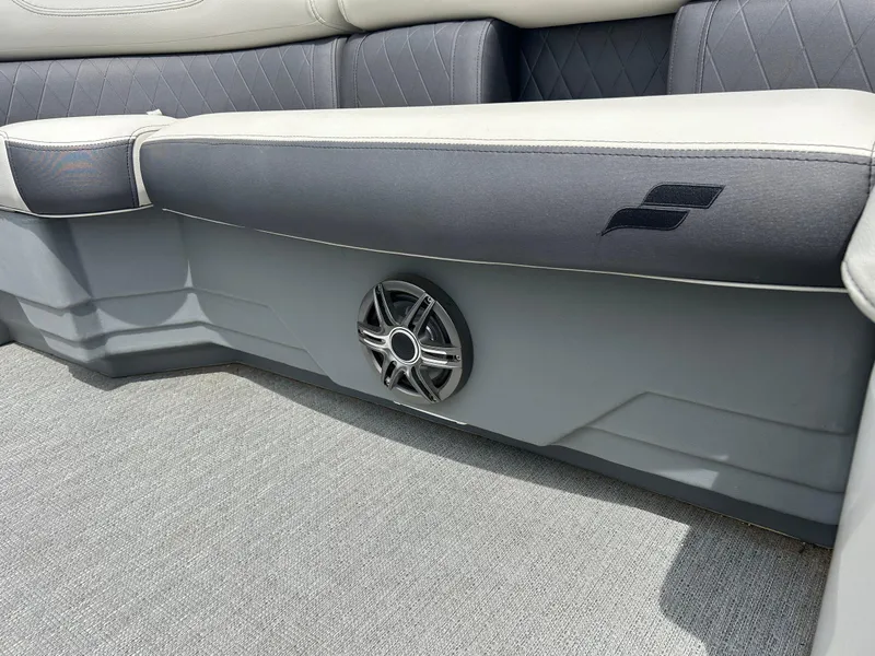 Slide: The Image of 2022 Starcraft CX21 boat interior with speaker and cushioned seating. - 45