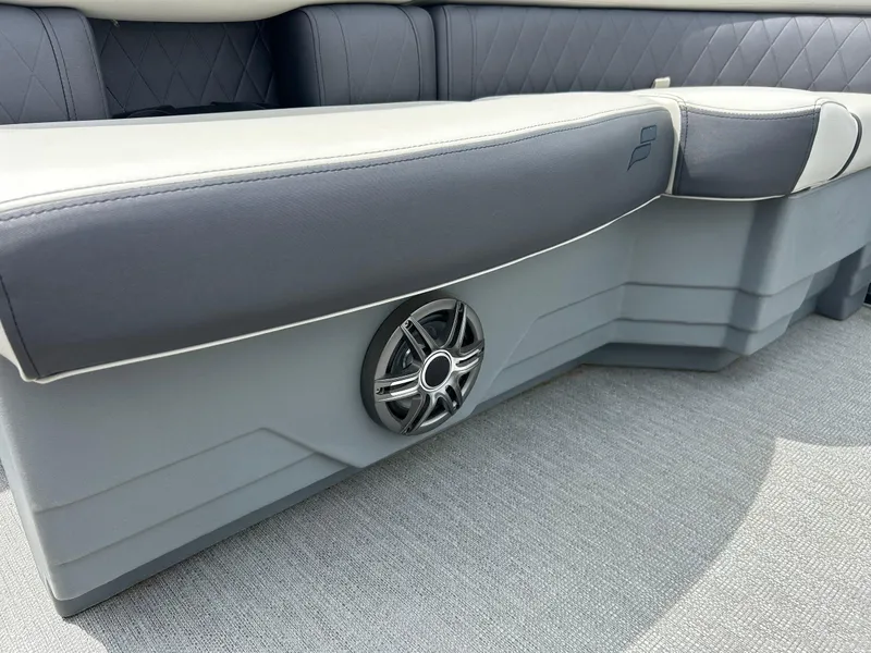 Slide: The Image of 2022 Starcraft CX21 boat interior with gray seating and built-in speaker. - 46