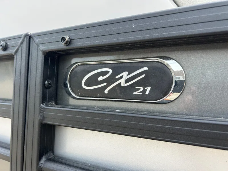 Slide: The Image of 2022 Starcraft CX21 logo on a metallic surface with black frame detailing. - 7