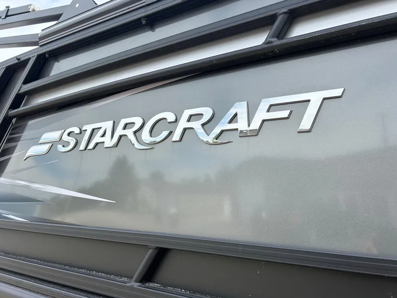Slide: The Image of 2022 Starcraft CX21 emblem on a sleek, metallic surface. - 8