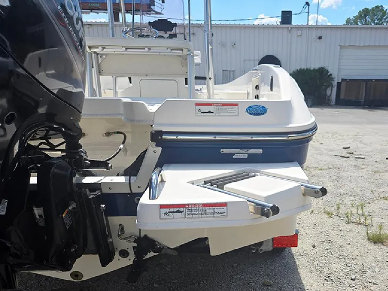 Slide: The Image of 2019 Bayliner Element F21 boat rear view with motor and swim platform. - 16
