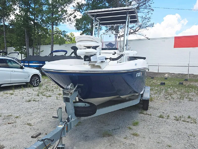 Slide: The Image of 2019 Bayliner Element F21 boat on trailer in outdoor setting. - 2