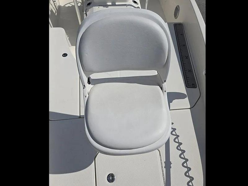 Slide: The Image of 2019 Bayliner Element F21 boat seat with measuring ruler on deck. - 21
