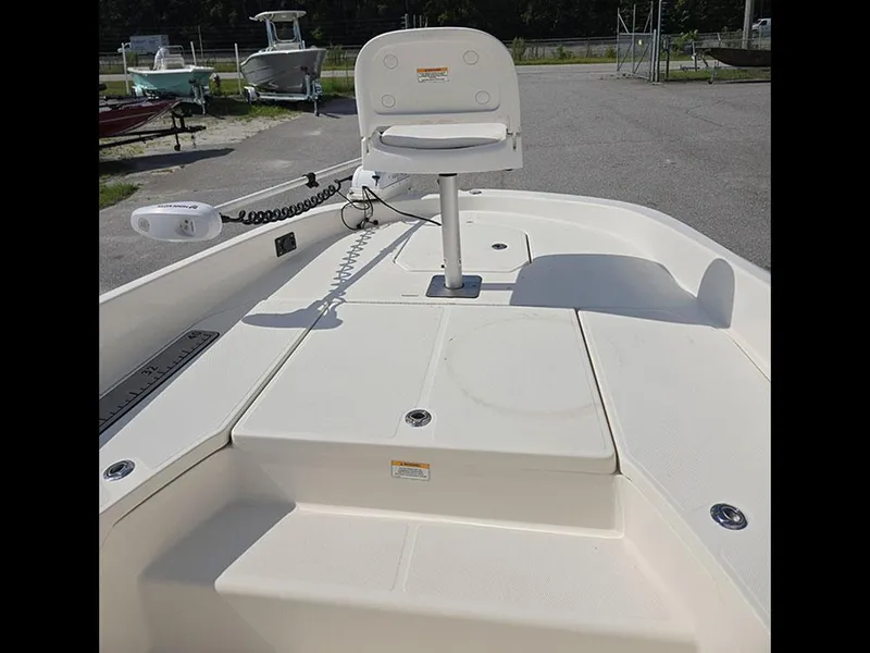 Slide: The Image of 2019 Bayliner Element F21 boat deck with seating and trolling motor. - 26