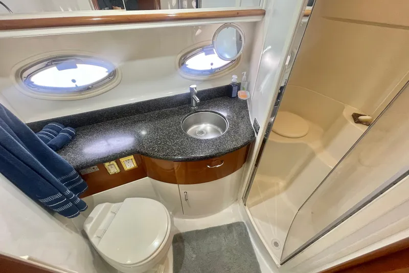Slide: The Image of Bathroom interior of 2004 Carver 44 Cockpit Motor Yacht with sink, toilet, and shower. - 61