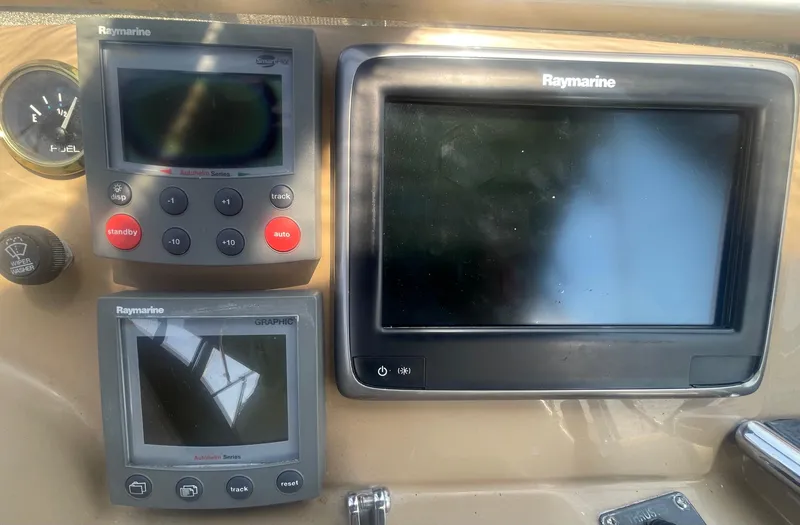 Slide: The Image of Raymarine navigation equipment on 2004 Carver 44 Cockpit Motor Yacht dashboard. - 42