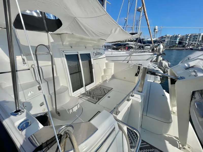 Slide: The Image of 2004 Carver 44 Cockpit Motor Yacht docked, featuring spacious deck and modern amenities. - 5