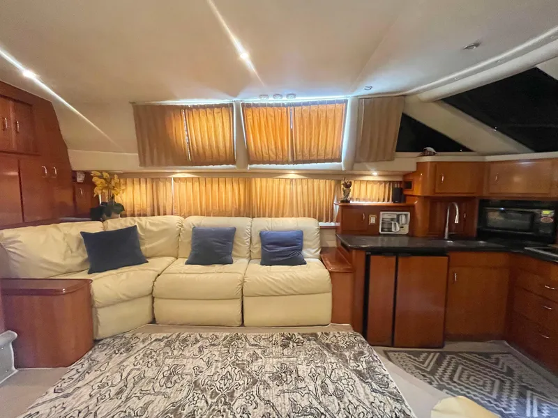 Slide: The Image of Luxurious interior of 2004 Carver 44 Cockpit Motor Yacht with plush seating and modern amenities. - 51