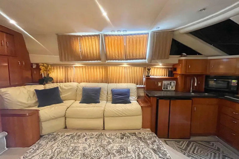 Slide: The Image of Luxurious interior of 2004 Carver 44 Cockpit Motor Yacht with cozy seating and modern amenities. - 56