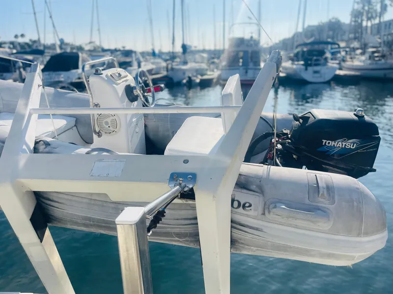 Slide: The Image of Inflatable boat with Tohatsu motor on Carver 44 Cockpit Motor Yacht, 2004, in marina. - 7