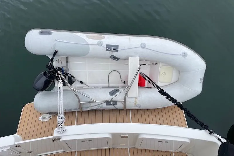 Slide: The Image of Top view of a 2006 Carver 42 Super Sport with an inflatable boat on deck. - 12