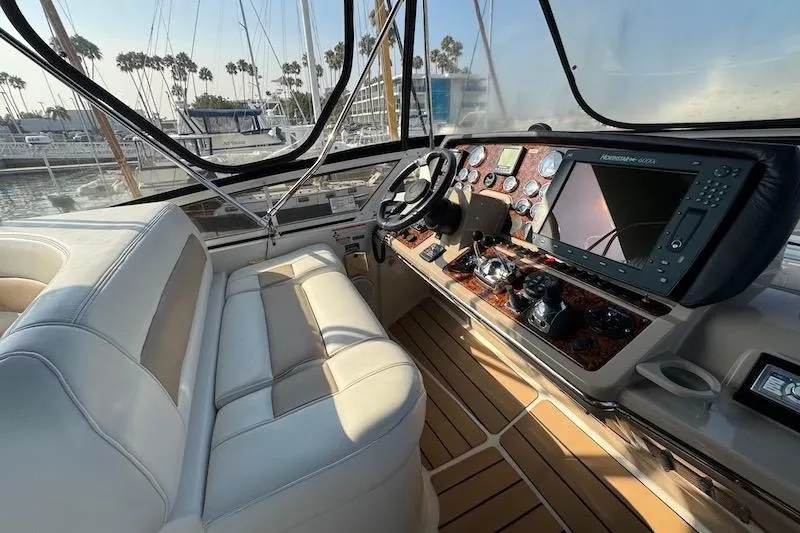 Slide: The Image of Interior of 2006 Carver 42 Super Sport yacht with luxurious helm and seating. - 21