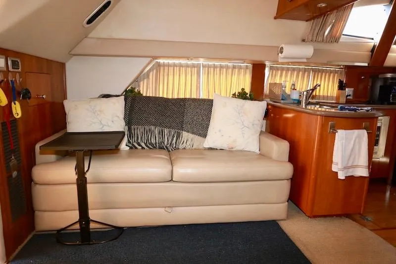 Slide: The Image of Interior of 2006 Carver 42 Super Sport yacht with cozy seating area. - 35
