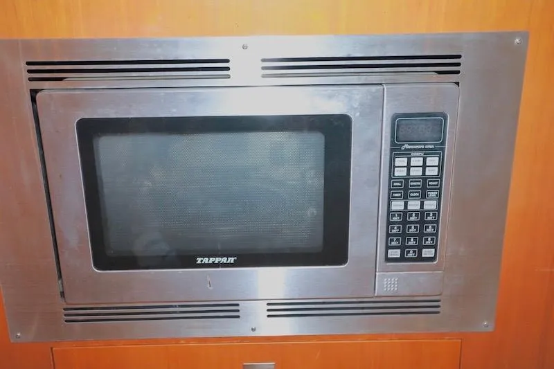 Slide: The Image of Built-in Tappan microwave in 2006 Carver 42 Super Sport yacht kitchen. - 43