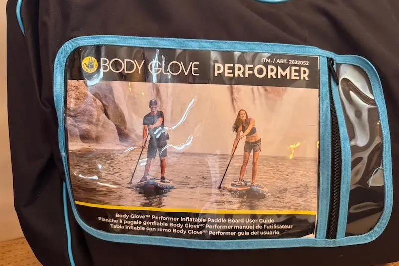 Slide: The Image of Body Glove Performer inflatable paddle board packaging with two people paddleboarding on water. - 59