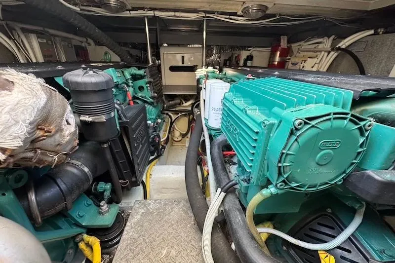 Slide: The Image of Engine room of a 2006 Carver 42 Super Sport yacht, showcasing mechanical components. - 62