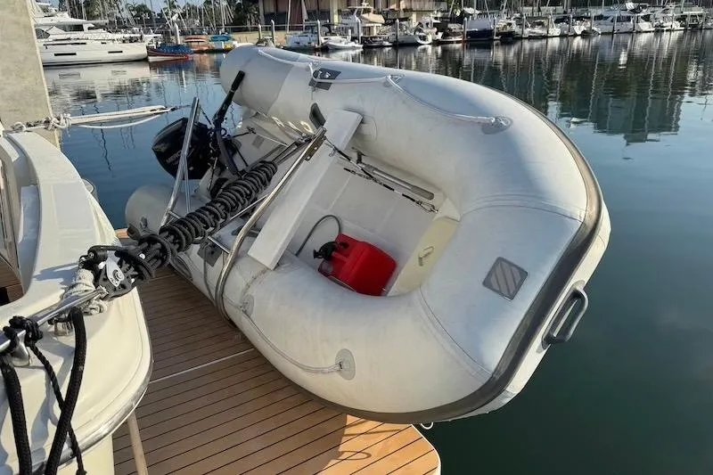 Slide: The Image of Inflatable dinghy secured on a 2006 Carver 42 Super Sport yacht at a marina. - 14