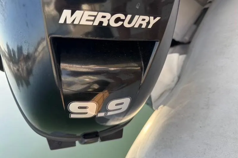 Slide: The Image of Mercury 9.9 outboard motor on a 2006 Carver 42 Super Sport boat. - 15
