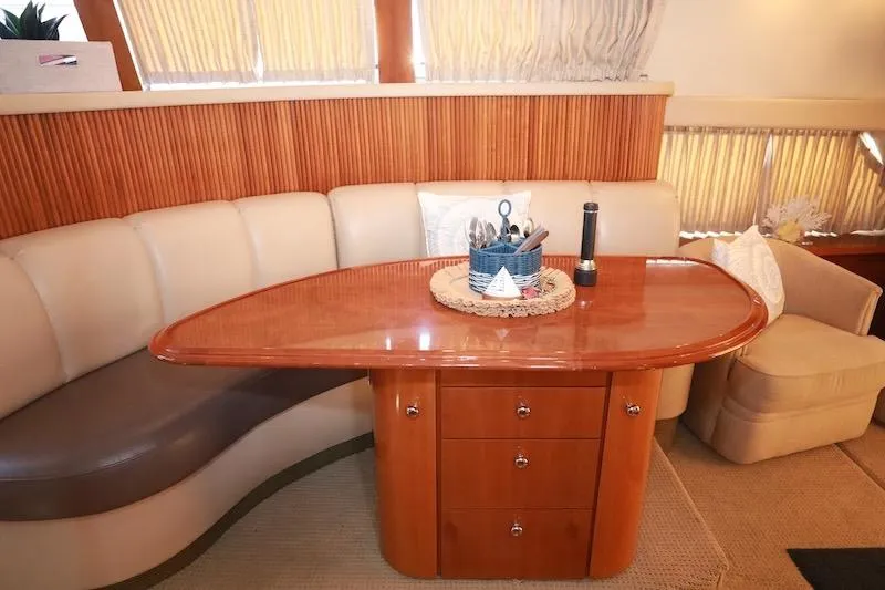 Slide: The Image of Luxurious interior of 2006 Carver 42 Super Sport yacht with elegant dining area. - 30