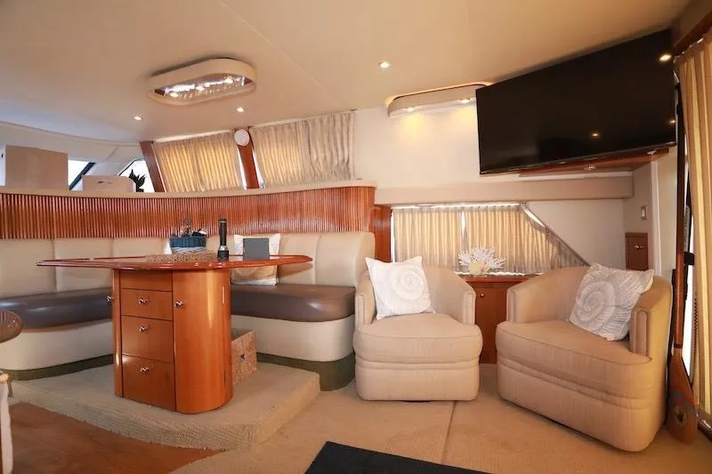 Slide: The Image of Luxurious interior of 2006 Carver 42 Super Sport yacht with elegant seating and modern decor. - 32