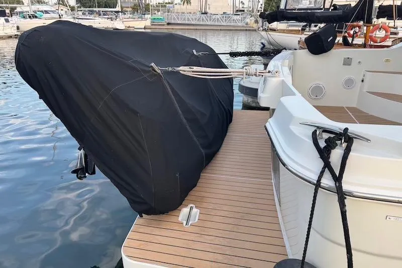 Slide: The Image of 2006 Carver 42 Super Sport yacht with covered outboard motor at marina. - 42