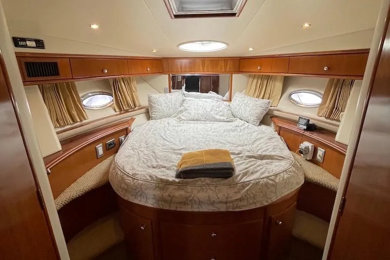 Slide: The Image of Luxurious cabin interior of 2006 Carver 42 Super Sport yacht with cozy bedding. - 45