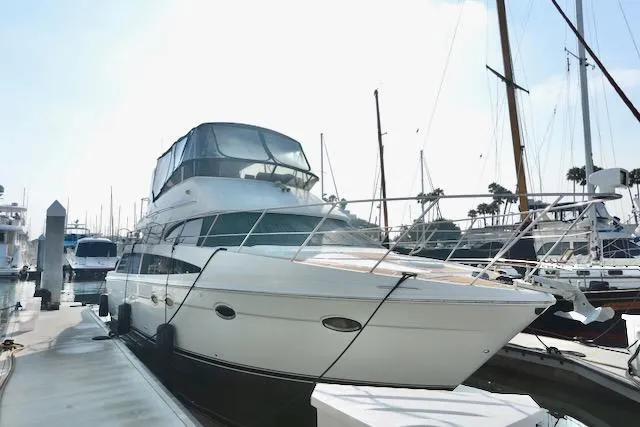 Slide: The Image of 2006 Carver 42 Super Sport yacht docked at marina, side view. - 6