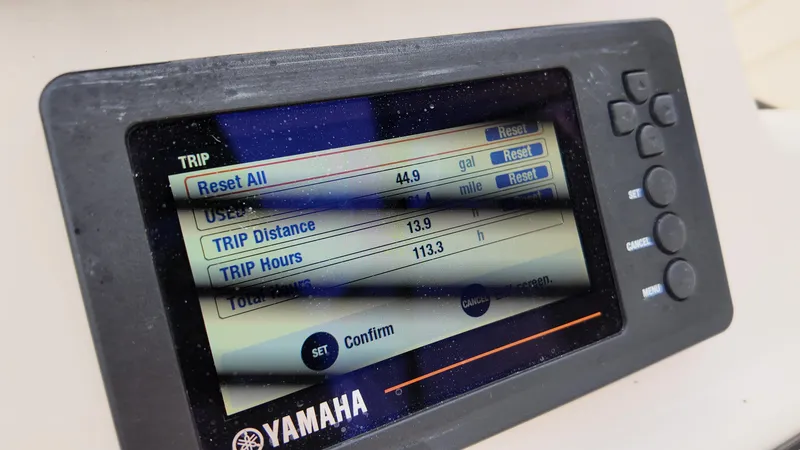 Slide: The Image of Yamaha display on 2018 Grady-White Freedom 215 showing trip data and settings. - 12