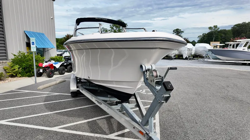 Slide: The Image of 2018 Grady-White Freedom 215 boat on trailer in parking lot. - 3