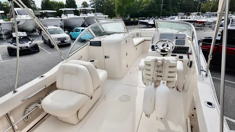 Slide: The Image of 2018 Grady-White Freedom 215 boat interior with white seating and control panel. - 5