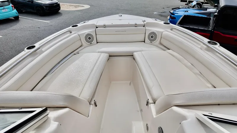Slide: The Image of 2018 Grady-White Freedom 215 boat interior with white cushioned seating. - 6