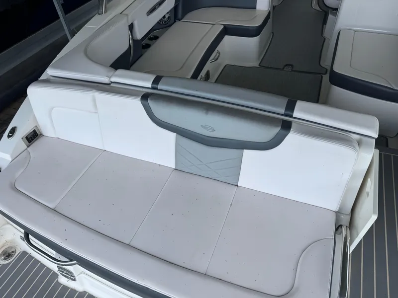 Slide: The Image of 2020 Chaparral 317 SSX boat interior with white and gray seating. - 15