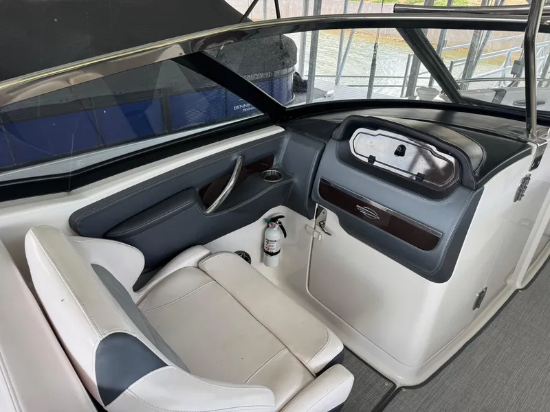 Slide: The Image of 2020 Chaparral 317 SSX boat interior with seating and dashboard view. - 22