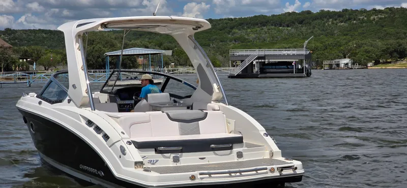 Slide: The Image of 2020 Chaparral 317 SSX boat on a lake with scenic background. - 5