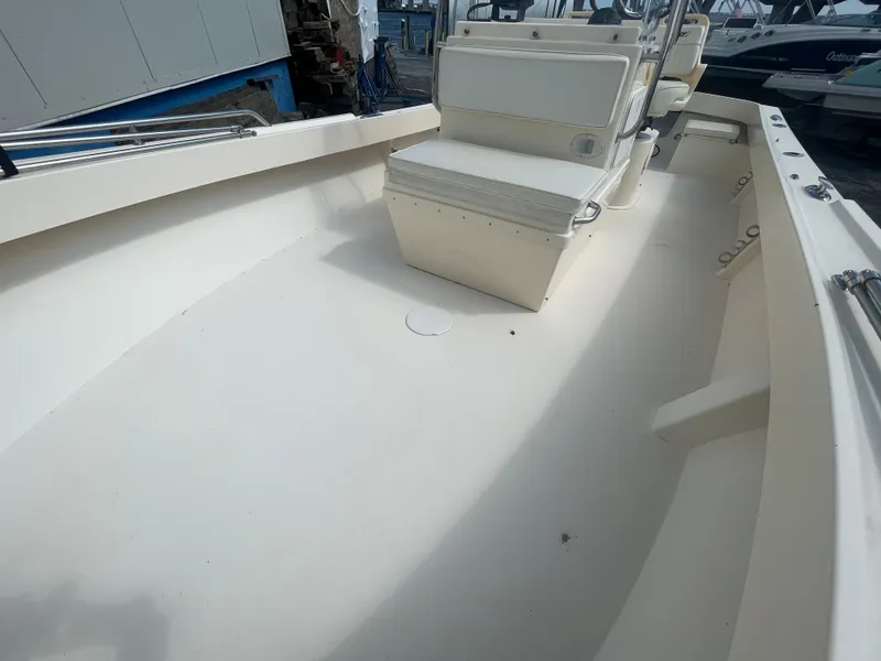Slide: The Image of 2011 Parker 21SE Center Console boat interior with seating and storage. - 10