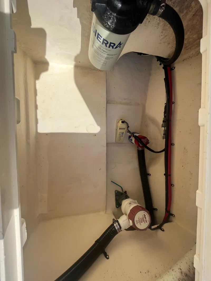 Slide: The Image of Interior of a 2011 Parker 21SE Center Console boat showing wiring and components. - 27