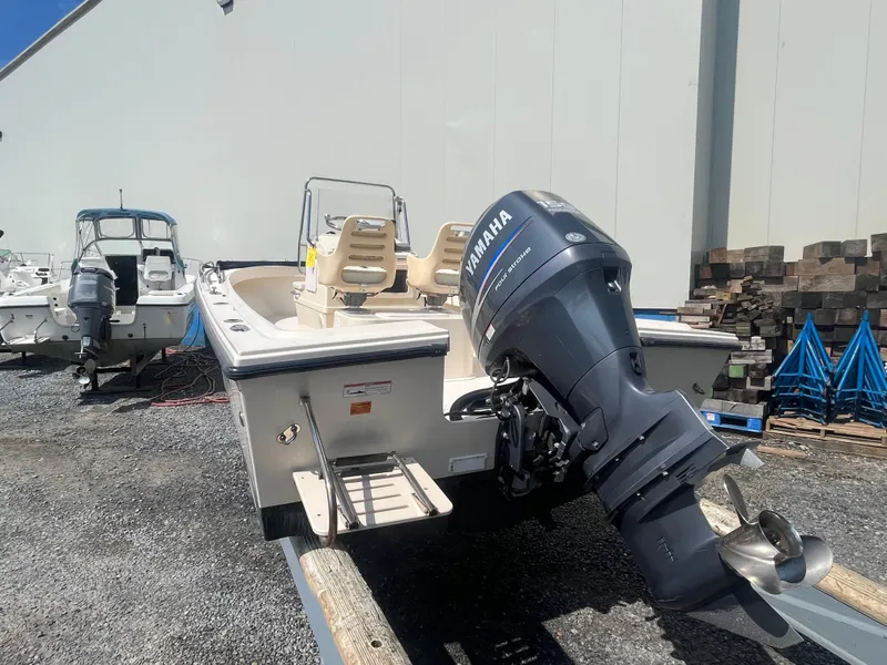 Slide: The Image of 2011 Parker 21SE Center Console boat with Yamaha outboard motor in a marina. - 3