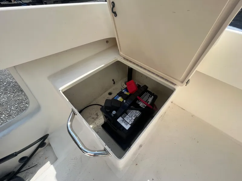 Slide: The Image of Battery compartment of 2011 Parker 21SE Center Console boat, open hatch view. - 31