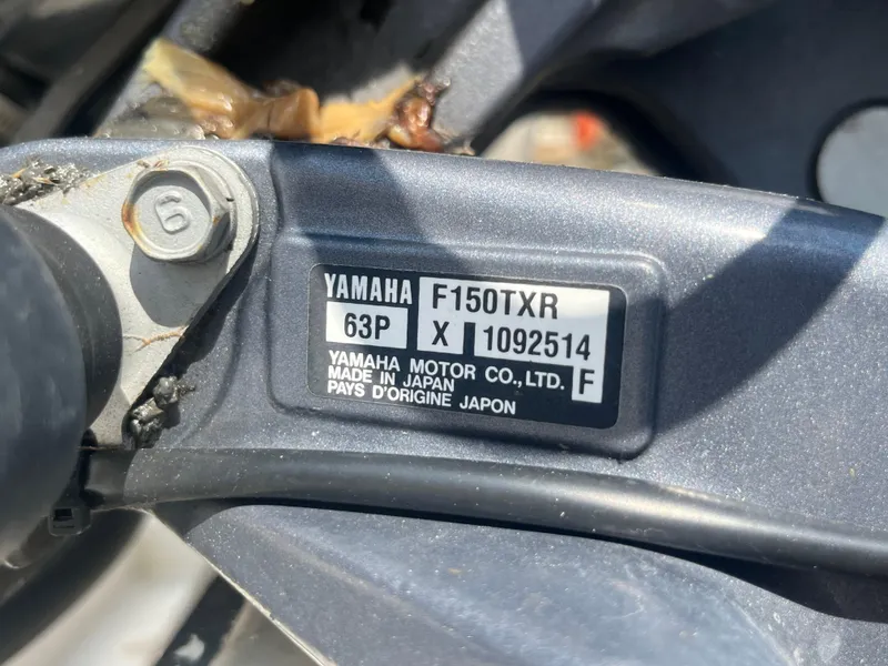 Slide: The Image of Yamaha F150TXR engine label on a 2011 Parker 21SE Center Console boat. - 33