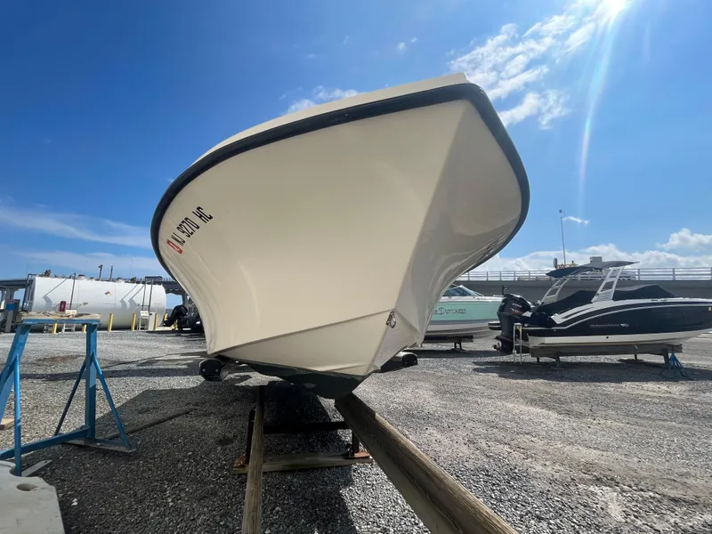 Slide: The Image of 2011 Parker 21SE Center Console boat on dry dock under clear blue sky. - 6