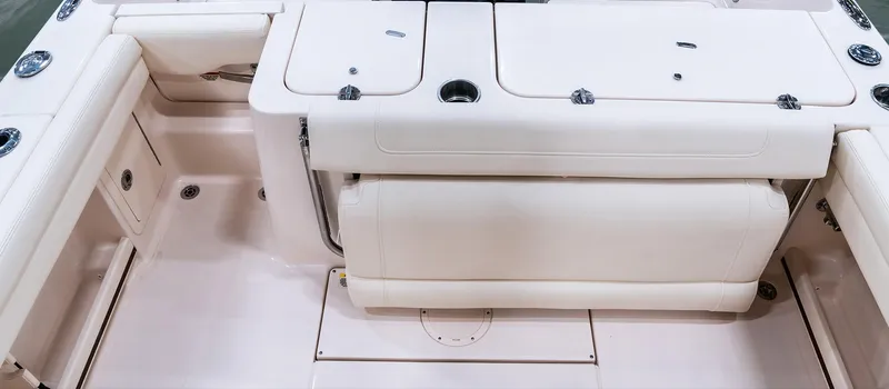 Slide: The Image of 2025 Grady-White Fisherman 236 boat interior with seating and storage compartments. - 11