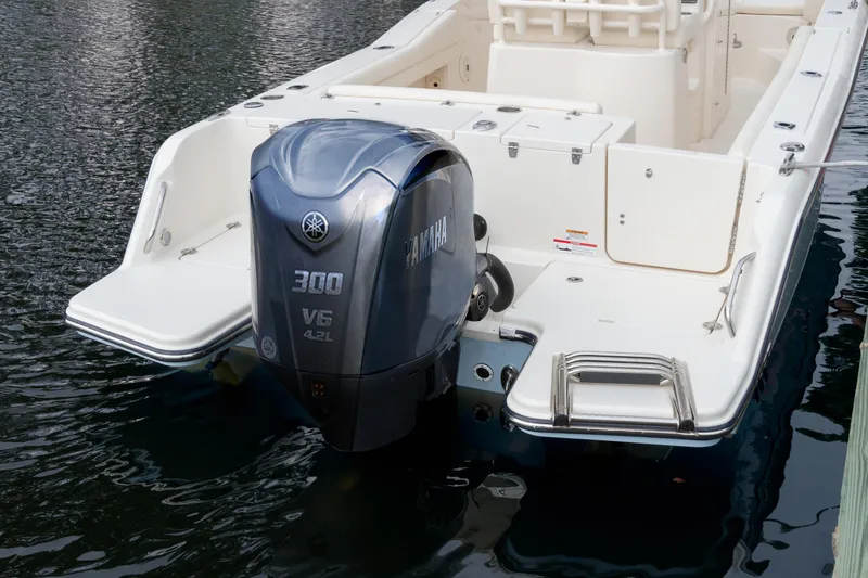 Slide: The Image of 2025 Grady-White Fisherman 236 with Yamaha 300 V6 outboard engine on water. - 16