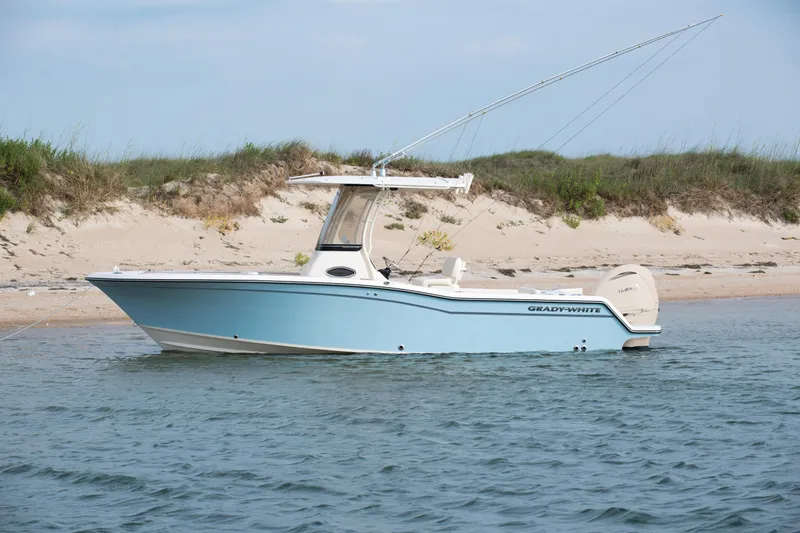 Slide: The Image of 2025 Grady-White Fisherman 236 boat anchored near sandy beach. - 4