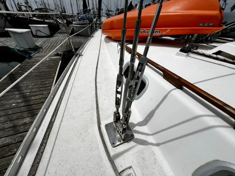 Slide: The Image of Deck of 1988 Hunter 40 sailboat with orange lifeboat and rigging details. - 14