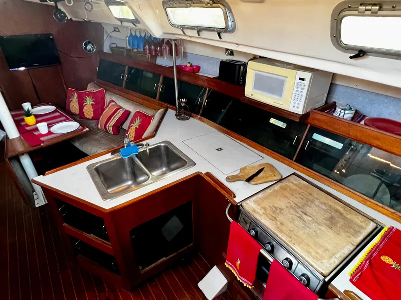 Slide: The Image of Interior of 1988 Hunter 40 yacht with kitchen and dining area. - 17