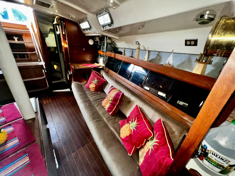 Slide: The Image of Interior of 1988 Hunter 40 sailboat with cozy seating and nautical decor. - 25