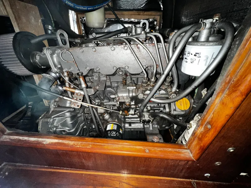 Slide: The Image of Engine of a 1988 Hunter 40 sailboat, showcasing intricate mechanical components. - 32
