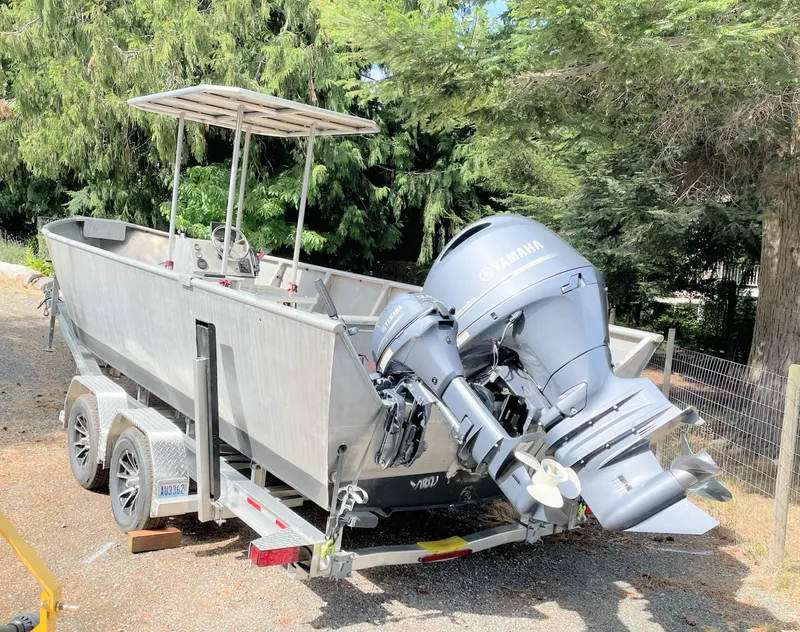 The Image of 2006 Pacific Boats 22 with Yamaha outboard motor on trailer, surrounded by trees. - 0